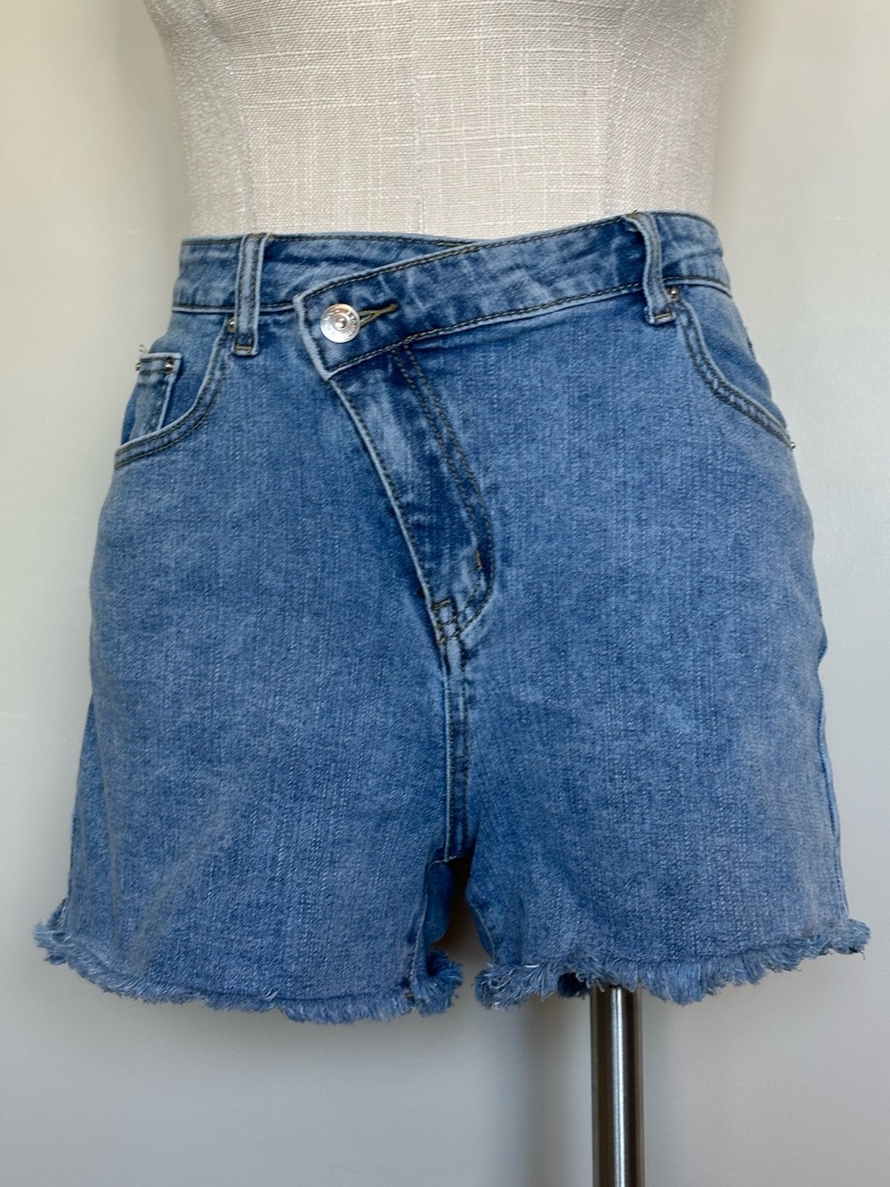 High-Rise Asymmetrical Crossover Denim Shorts - Medium Blue Wash